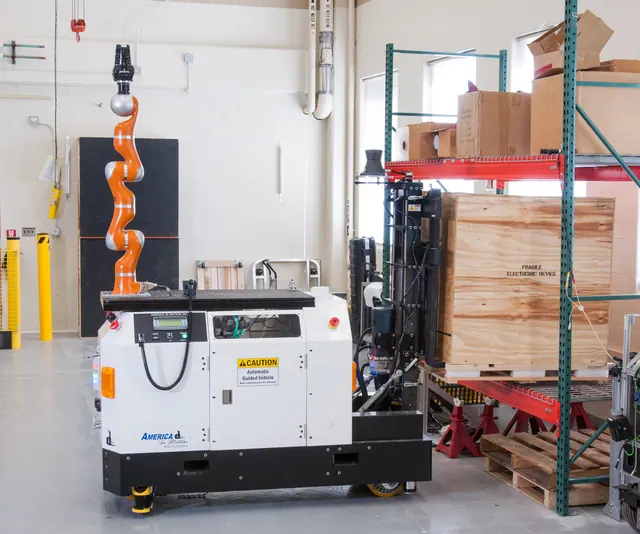 automated guided vehicle removing a crate from a rack
